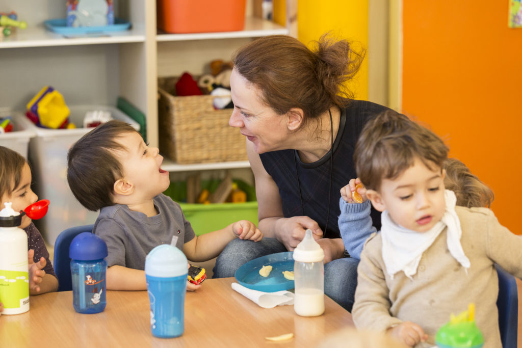 Nursery Les Marronniers - Educator interacting in English with toddler