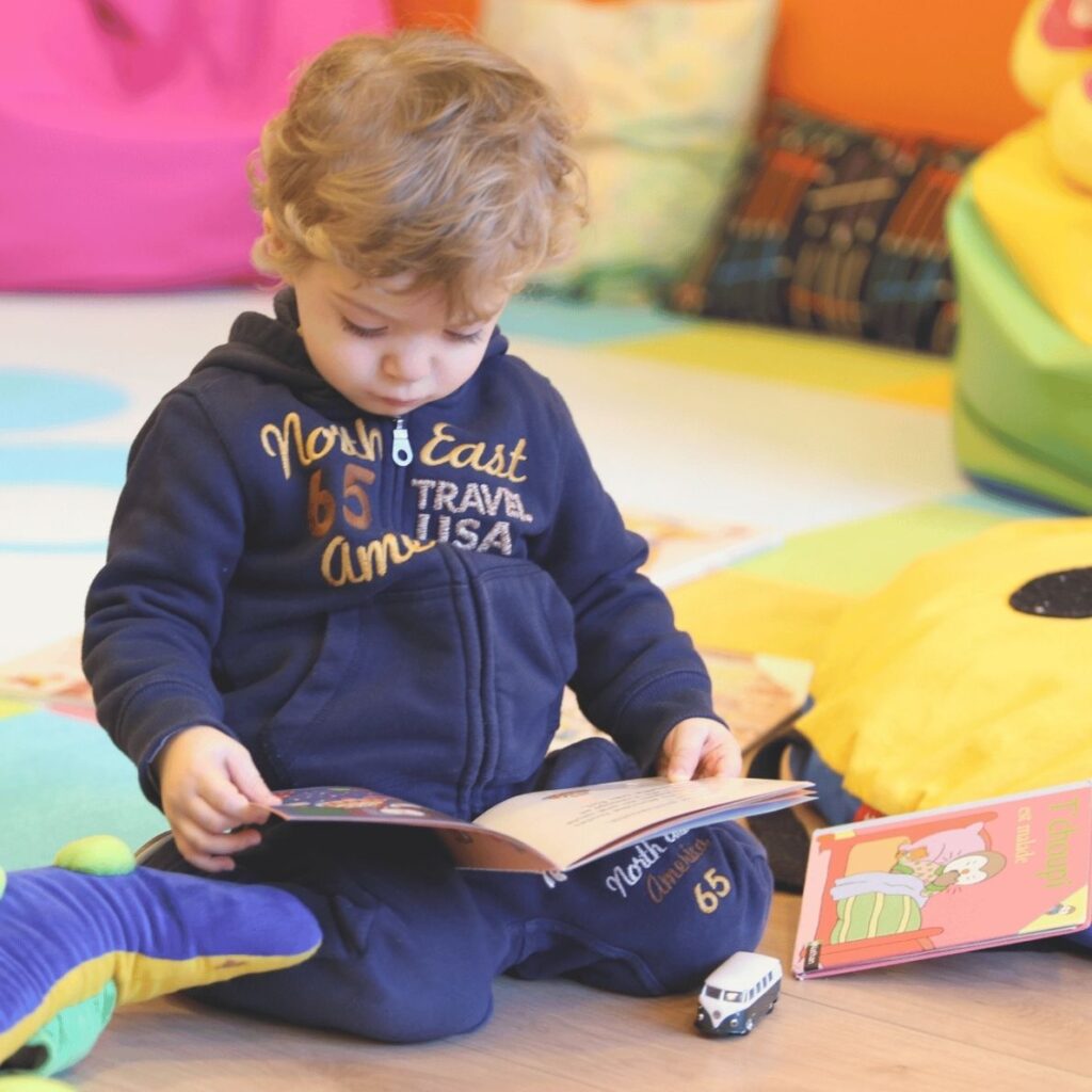 Toddler reading a book